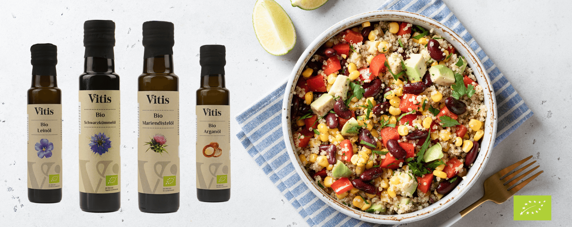 Verschiedene Bio Öle der Firma Vitis Traubenkern GmbH neben einer Schüssel mit Couscoussalat.