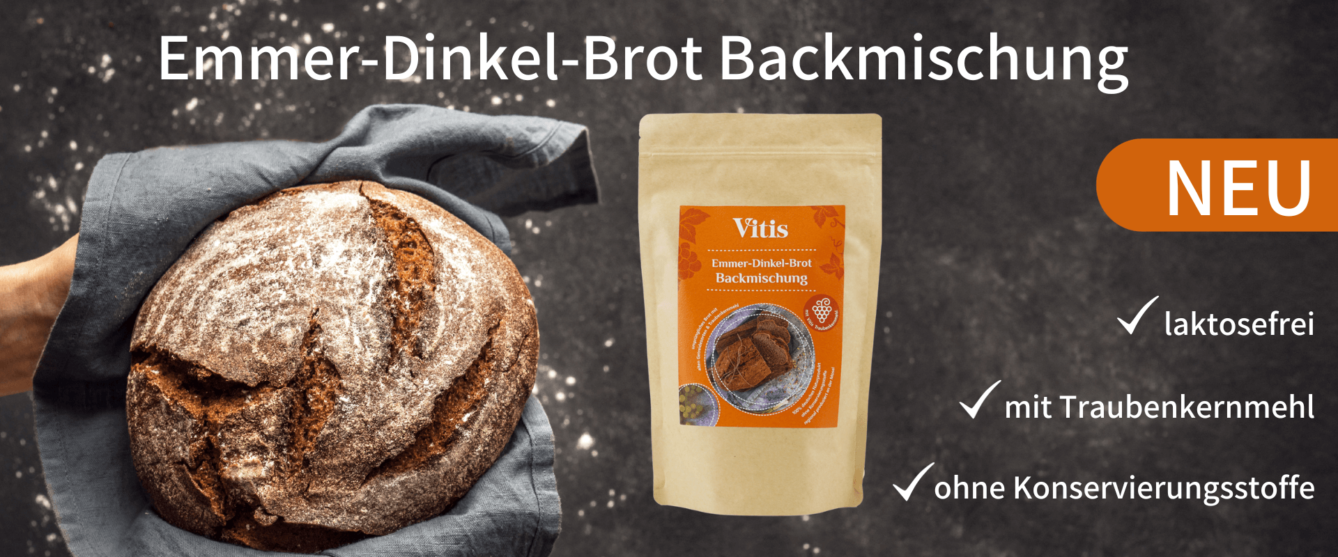 Eine 500g Emmer-Dinkel-Brot Backmischung von Vitis neben einen frisch gebackenen Brot.